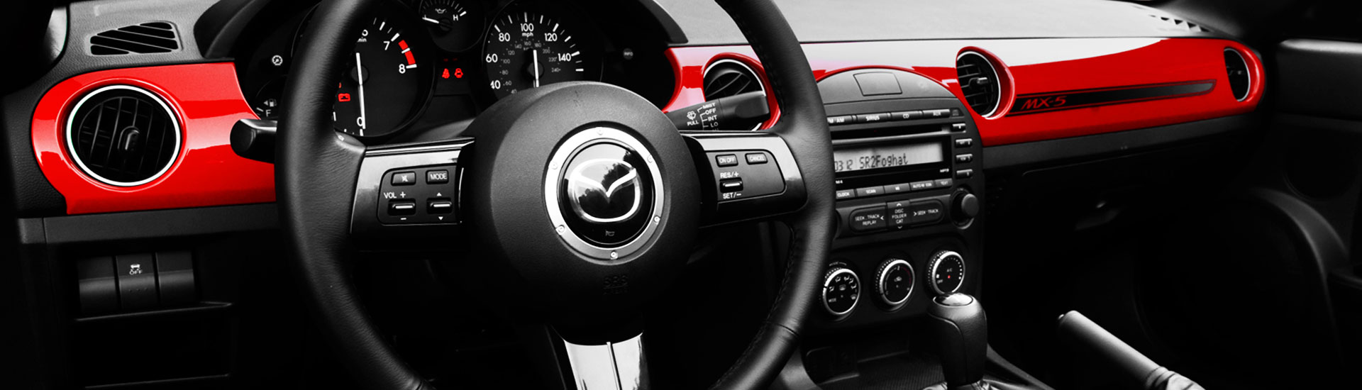 Red dash kit inside Mazda